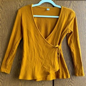 Old Navy mustard yellow wrap style sweater. Flatters the waist with a tie. XS